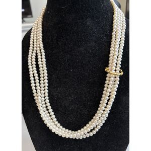 100 inches (about) of real pearls with a gold or gold tone fastener